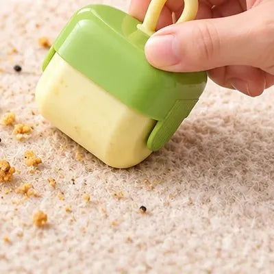 Roller picking up crumbs from a rug